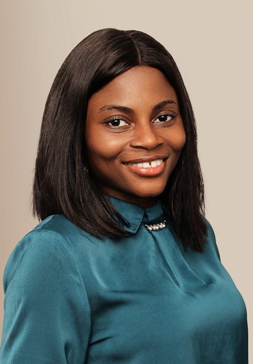 A woman with long hair and a blue shirt