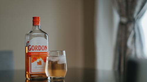Gin on Ice and a Bottle of Gordons Sunset Orange