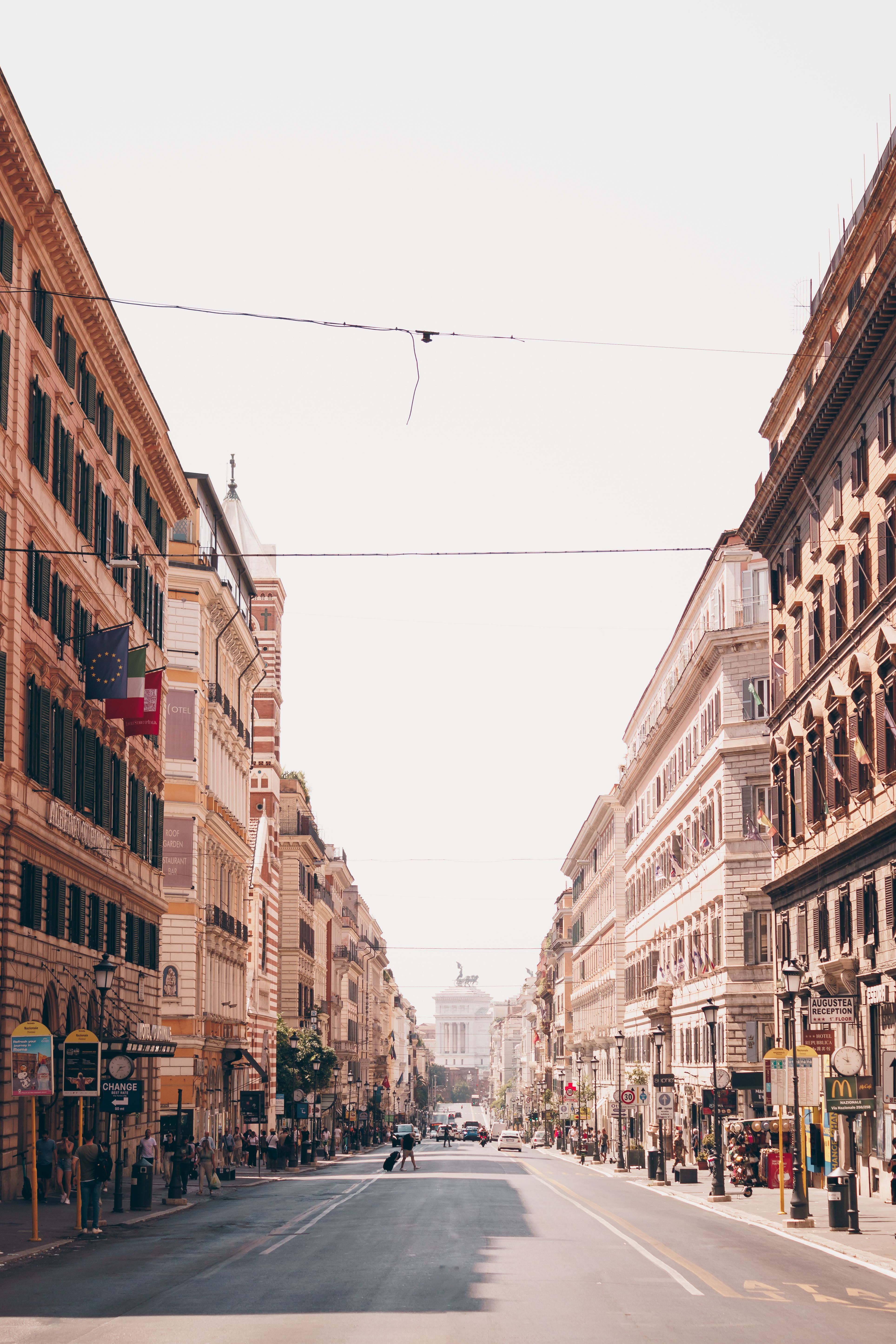 Explore Rome's vibrant city streets with classic architecture and bustling atmosphere.