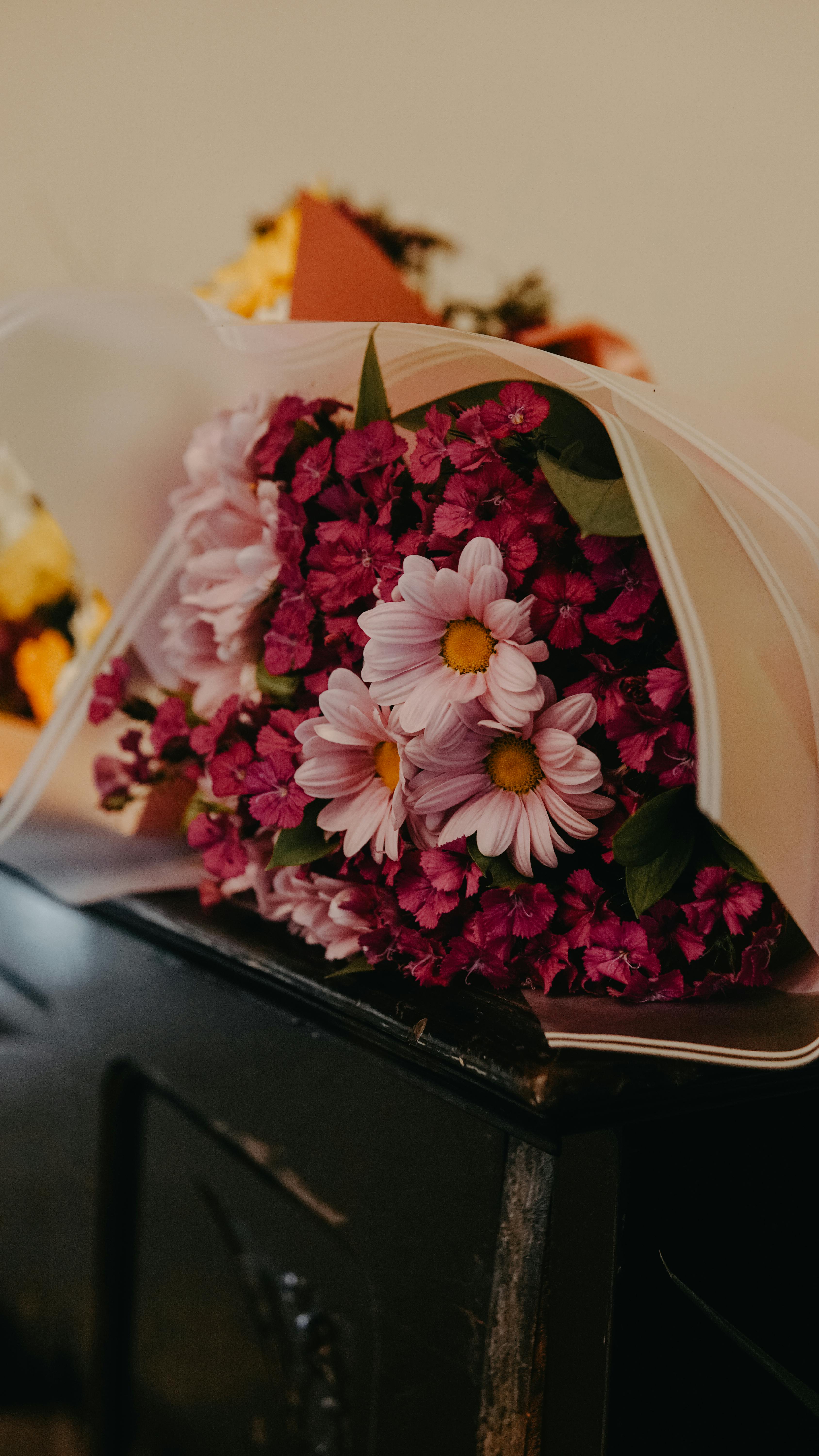 [ColoSach]-beautiful-pink-and-purple-bouquet-arranged-elegantly-on-a-vintage-dresser.-ideal-for-floral-decoration-themes.