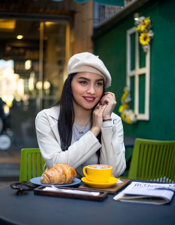 Woman in neutral monochrome brunch outfit
