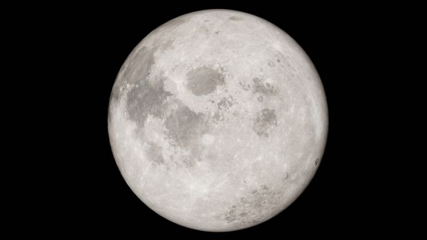 Detailed image of a full moon against a black night sky, showcasing lunar features.