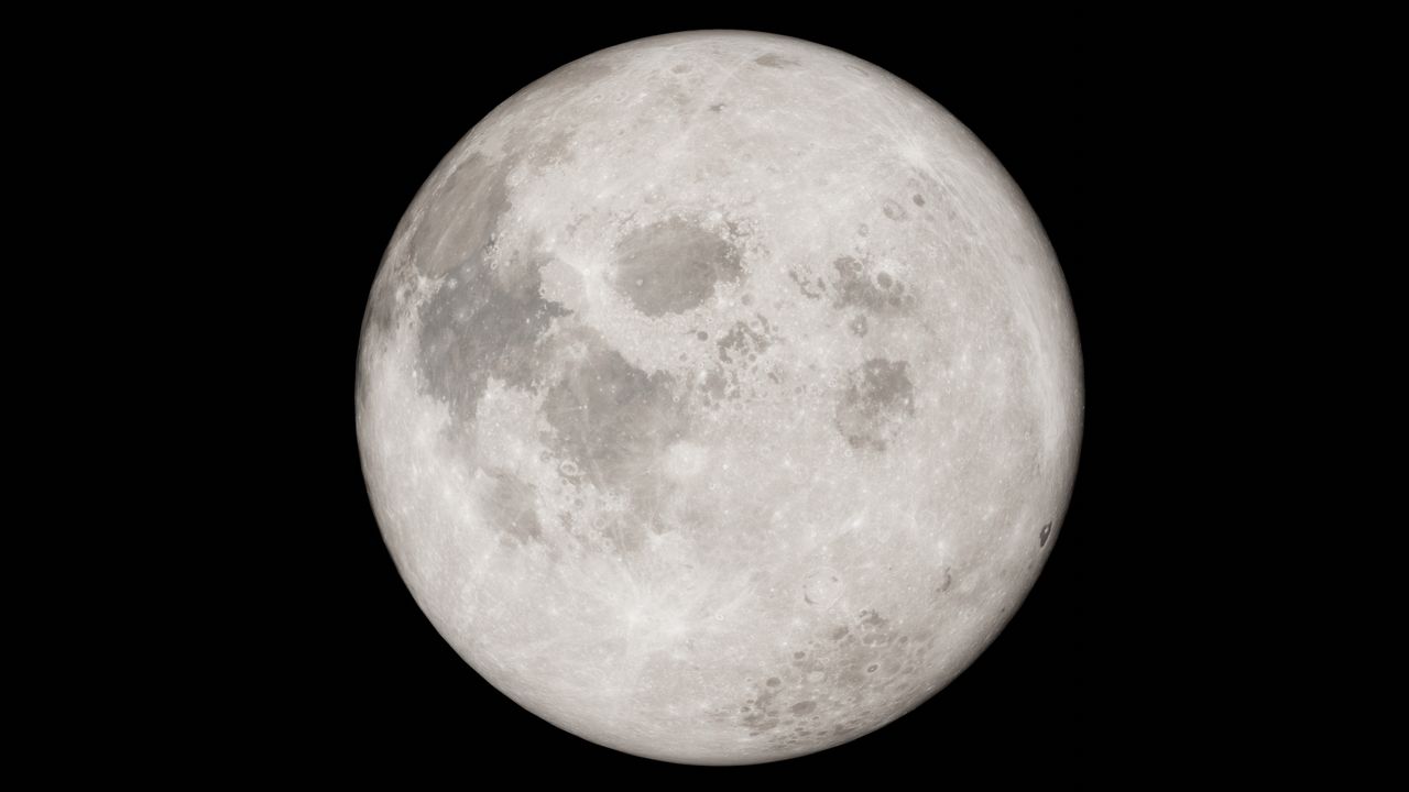 detailed image of a full moon against a black night sky showcasing lun