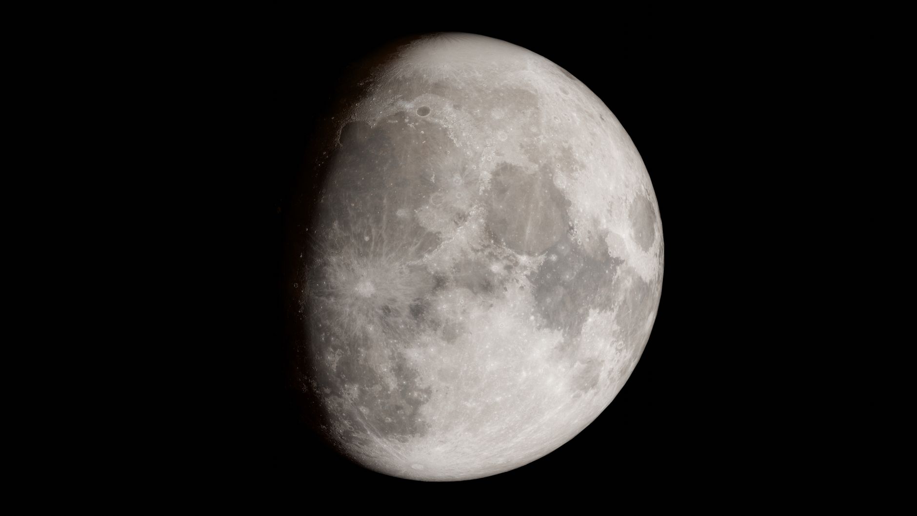 Crisp image of the moon's detailed surface against a dark background, showcasing its craters.