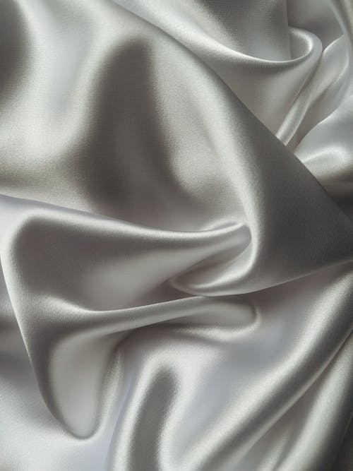 A close up of a white satin fabric