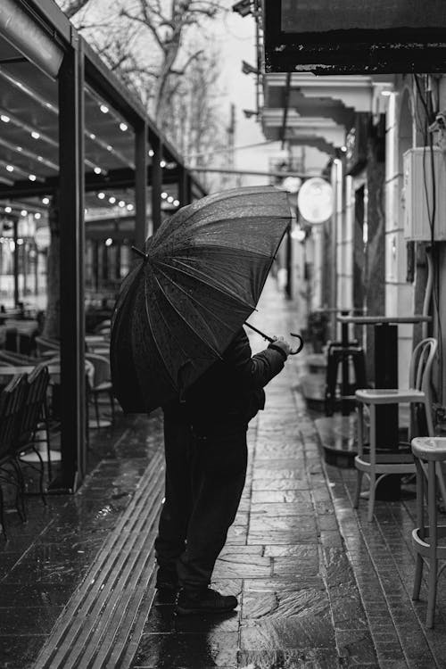 Man with Umbrella in Rain