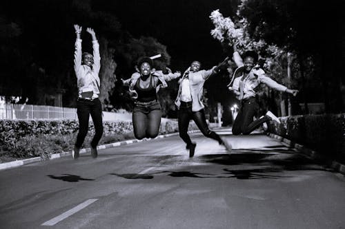 Group Of People Doing A Jump Shot