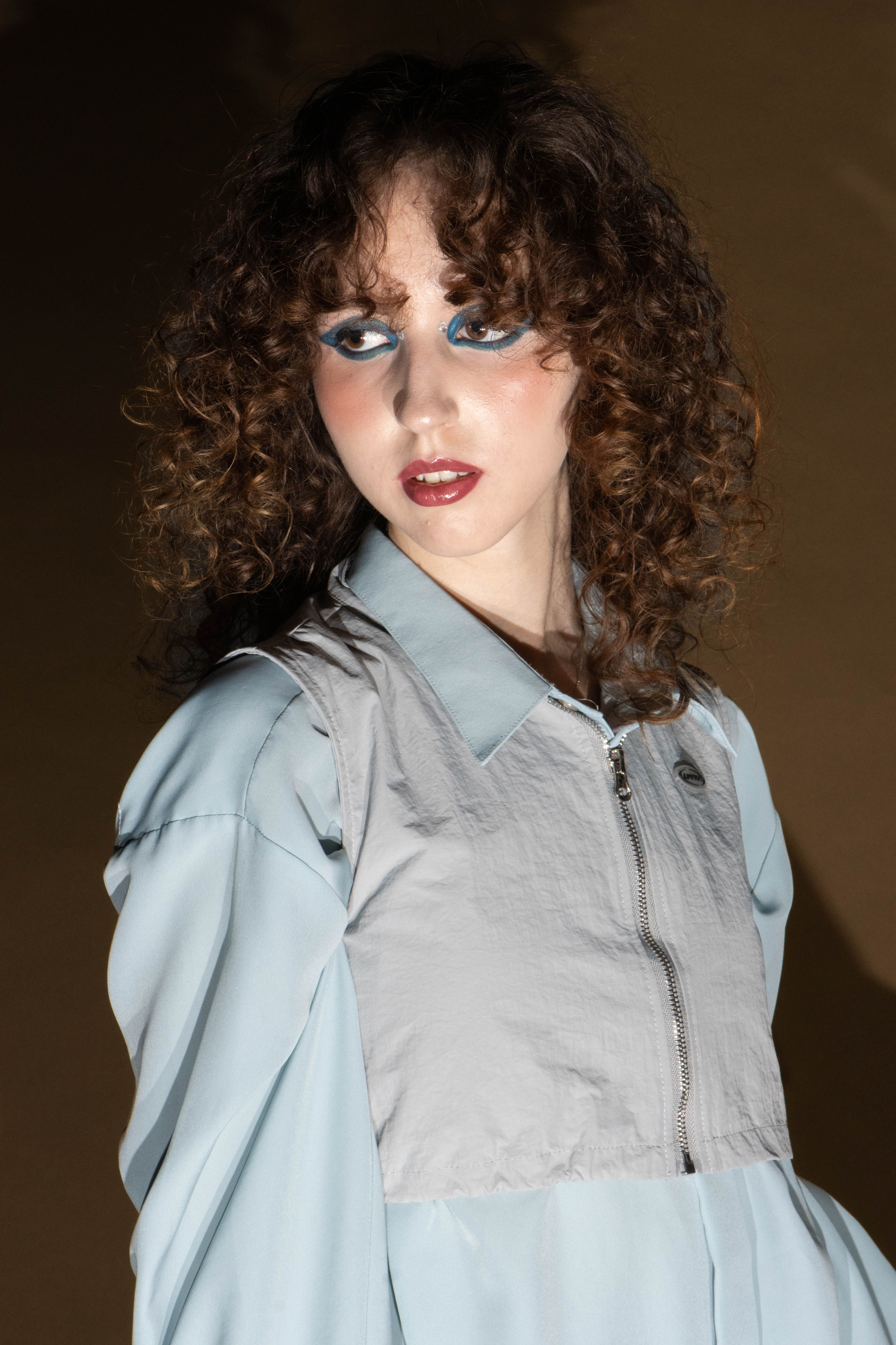 Portrait of Woman with Curly Hair · Free Stock Photo