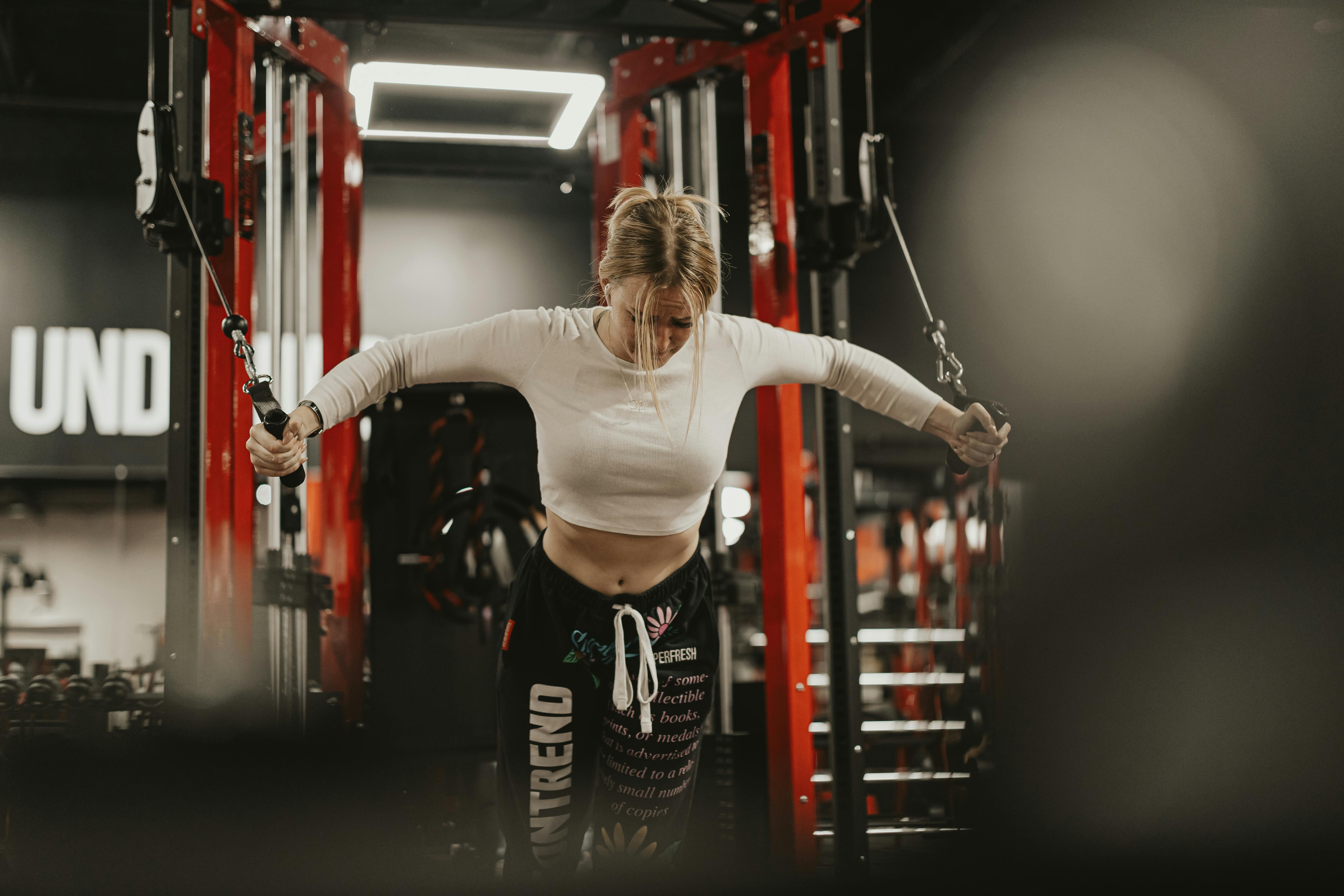 of a person lifting weights in a clean, modern gym setting - how to lose weight