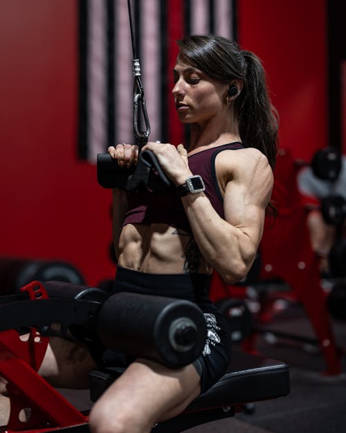 Brunette Woman Exercising at Gym