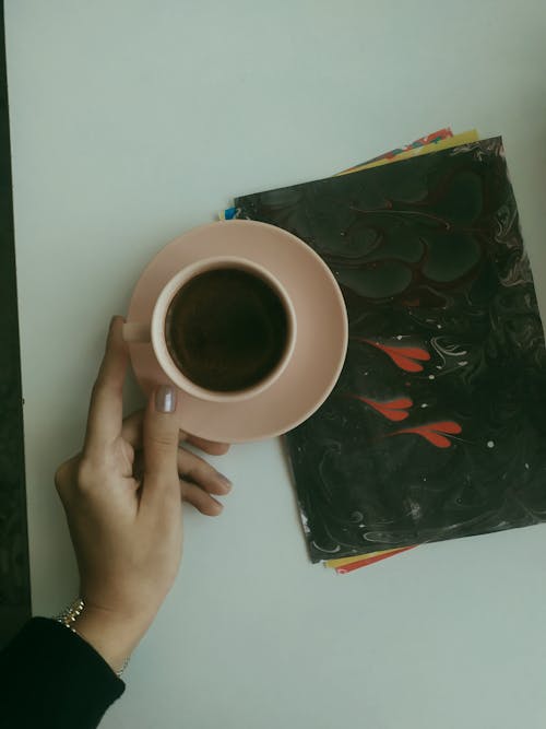 Woman Hand Holding Cup of Coffee