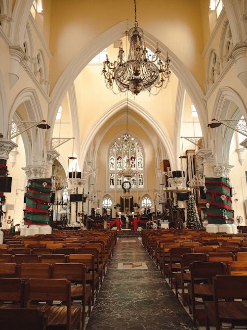 A church with pews and a chandelier