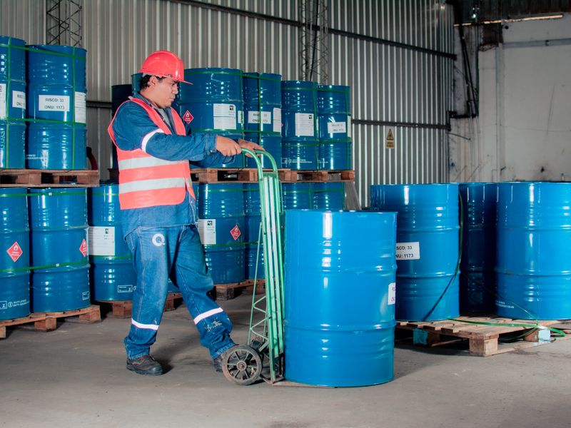 Warehouse worker moving goods with a hand truck