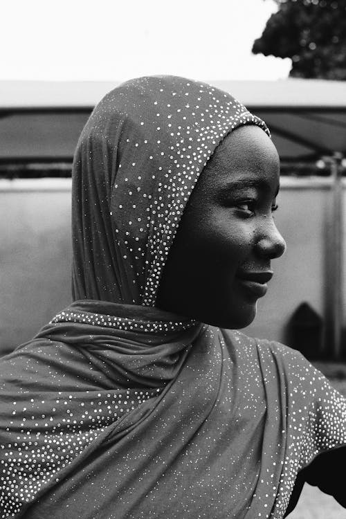 Black and White Photo of a Young Woman in a Hijab 