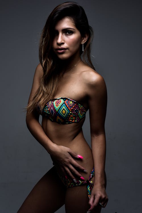 A woman in a bikini posing for a photo