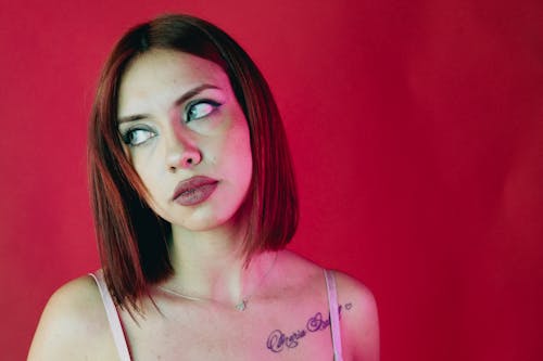 Studio Shot of a Young Woman with a Tattoo