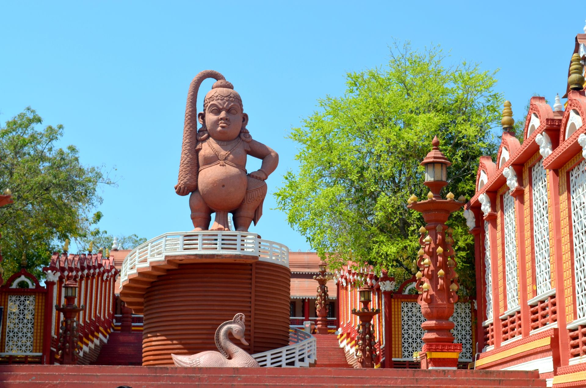 Intricate traditional sculpture located in Ramoji Film City, Hyderabad surrounded by vibrant architecture.