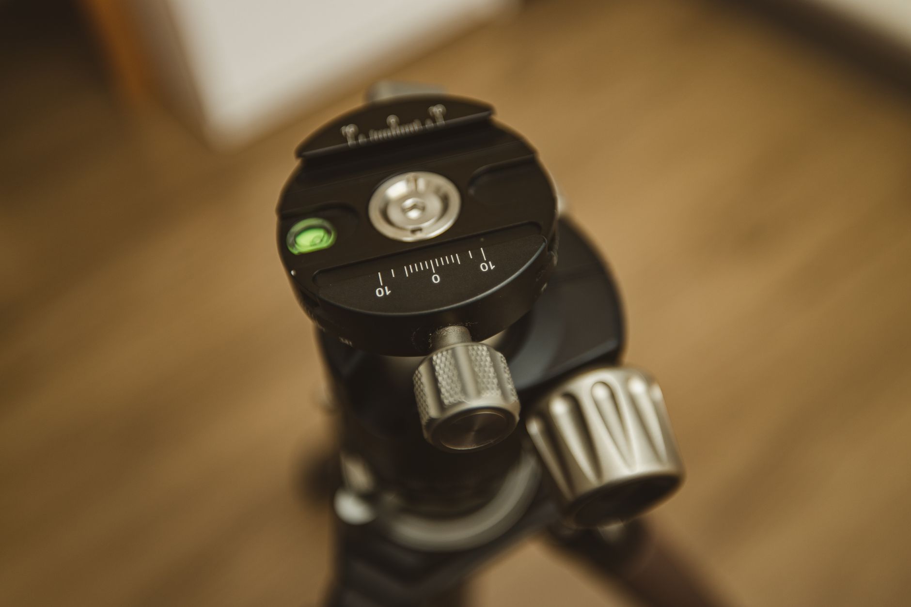 Detailed view of a black tripod head, essential equipment for photographers.