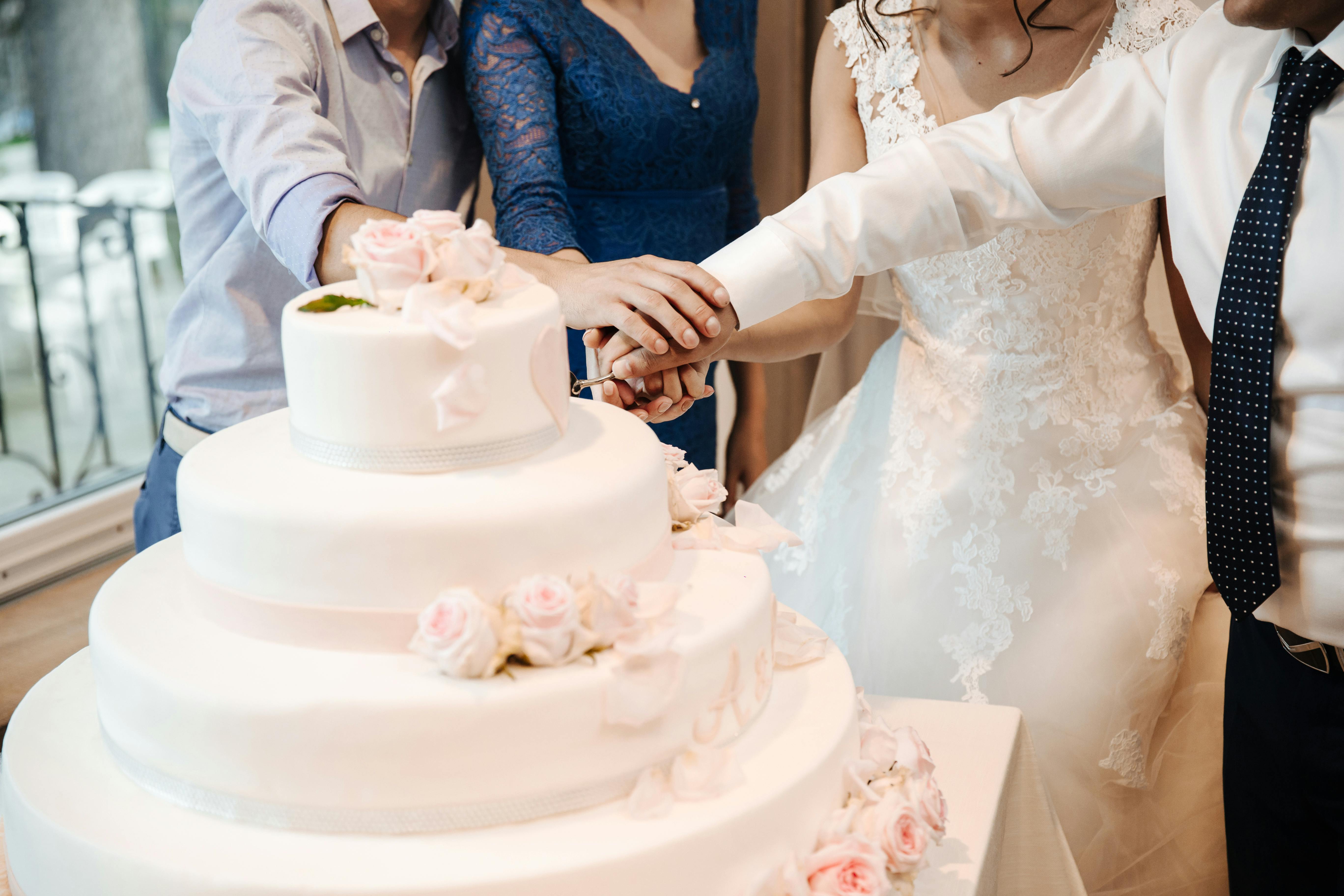 people cutting cake