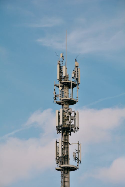 A cell tower with a blue sky in the background