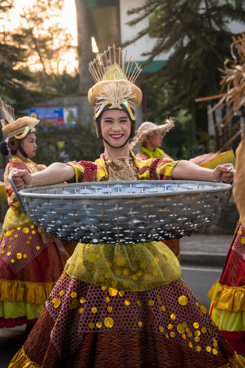 Free Colorful dancers in traditional attire celebrating a festival in Baguio, Philippines. Stock Photo