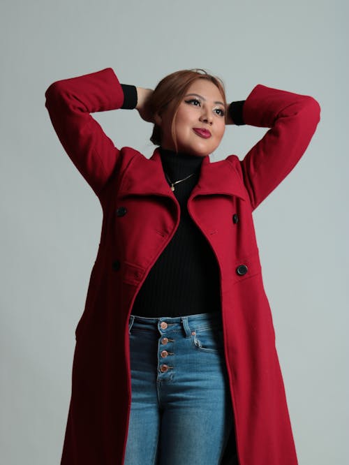Woman Standing in Red Coat
