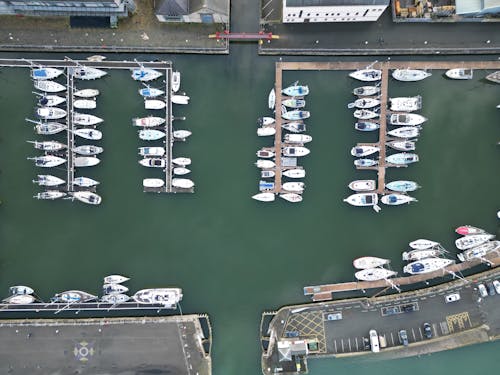 Aerial view of a marina with many boats