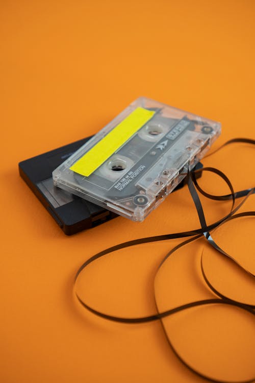 An old cassette player with a cord attached to it