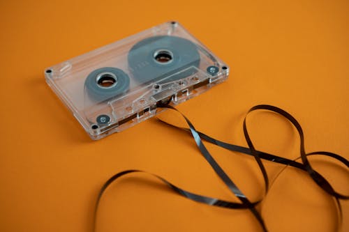 An old cassette tape with a black ribbon on it