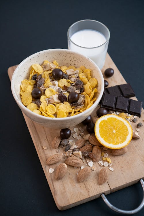 Cereal with nuts, chocolate and orange slices