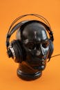 Headphones on Black Head of Mannequin