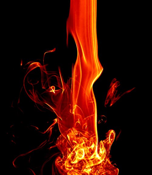 Free A Flame on a Black Background  Stock Photo