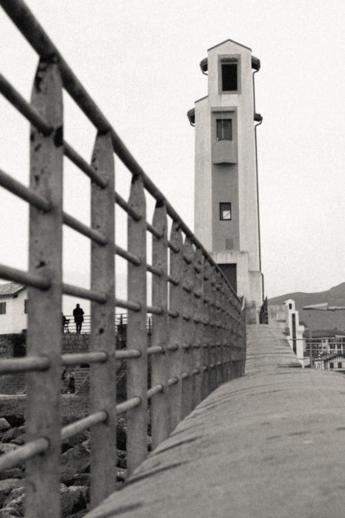 Railing and Lighthouse behind in Black and White