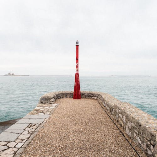 Modern Red Lighthouse on Pier