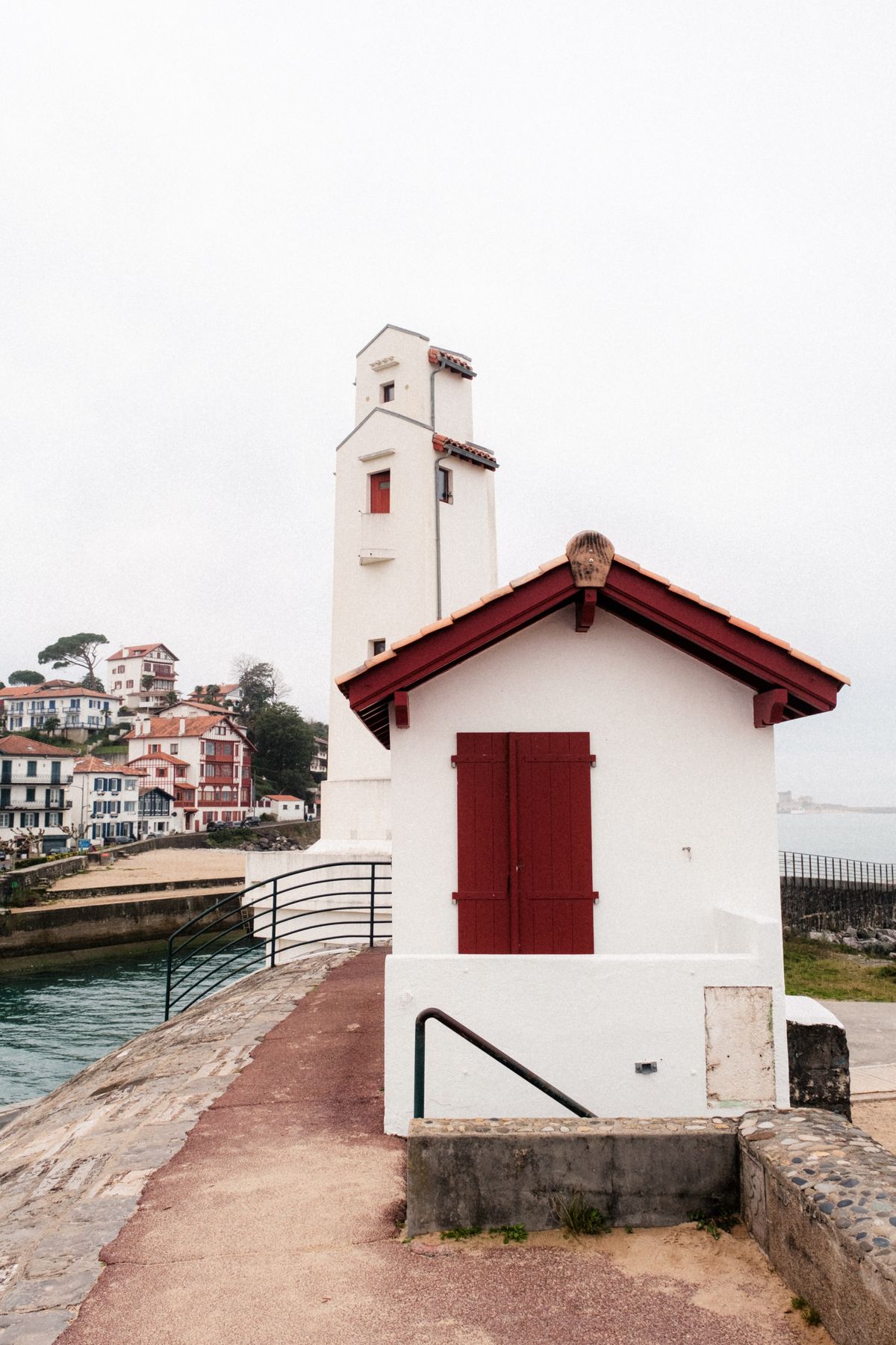 The white signal tower and red-shuttered hut on the Saint-Jean-de-Luz jetty