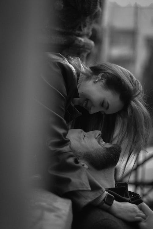 Smiling Woman and Man Hugging in Black and White