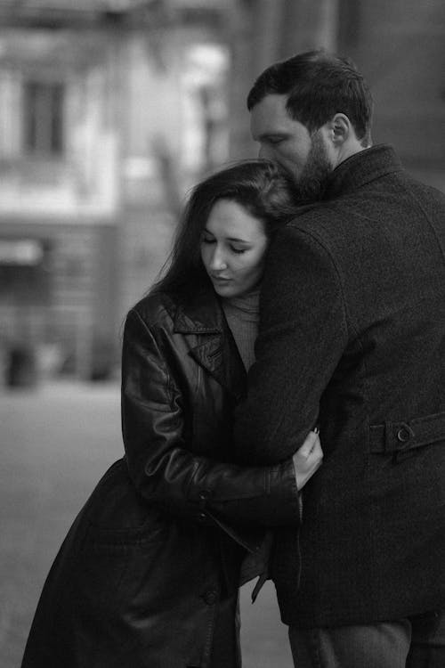 Woman Hugging Man in Black and White