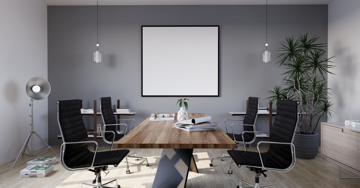 Sleek and modern conference room with minimalist design featuring stylish furniture and indoor plants.