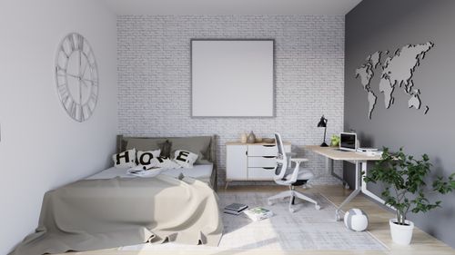 Free Bright modern minimalist bedroom featuring a desk workspace, bed, and decor accents. Perfect for home interior inspiration. Stock Photo