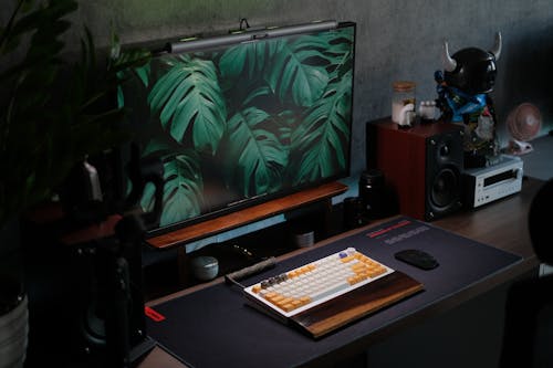 A desk with a computer and a monitor on it