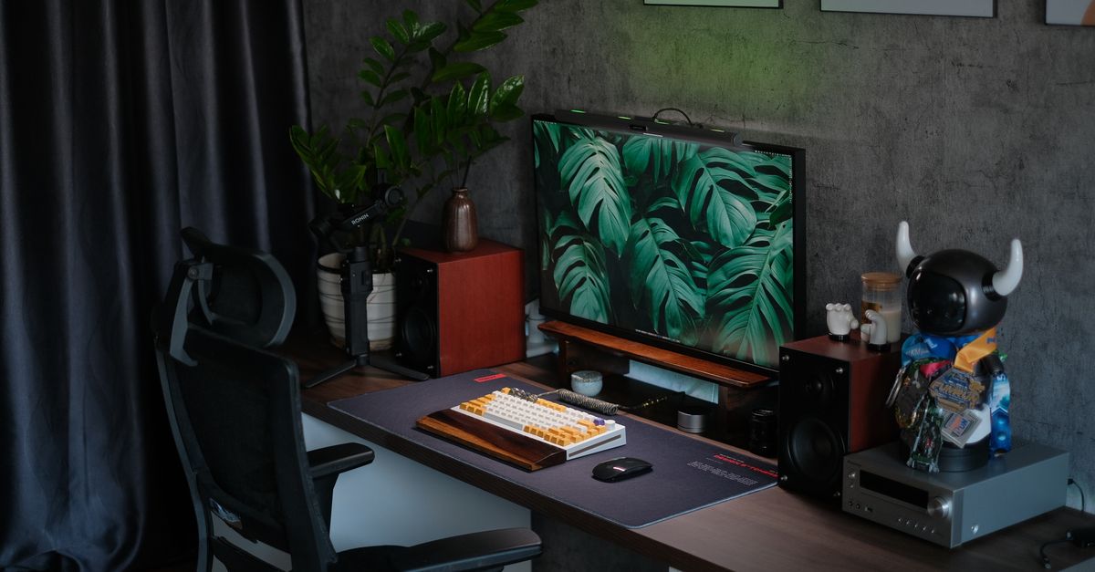 minimalist home office setup with plants, natural light, and cozy atmosphere