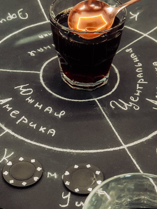 A blackboard with a drink and a glass of vodka