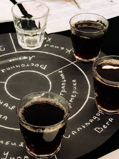 A blackboard with three glasses of beer on it
