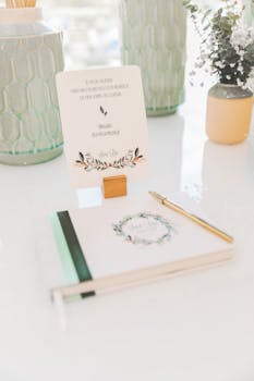 Creative writing setup featuring elegant floral stationery and decor in a bright setting.