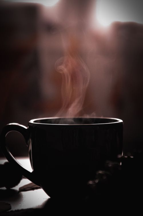 Free A steaming cup of coffee exudes warmth in a serene indoor setting, perfect for a cozy morning. Stock Photo