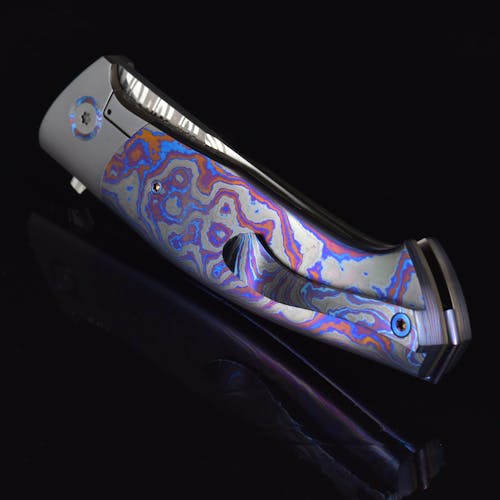 A knife with a colorful design on it