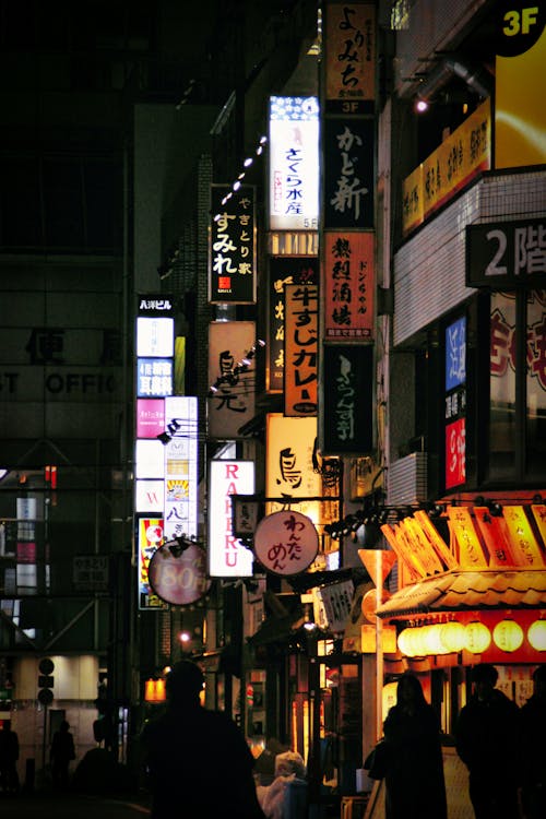 View of Illuminated Signs on Buildings in Tokyo at Night 