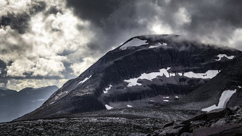 A dark black mountain in Norway in the Trollheimen group.