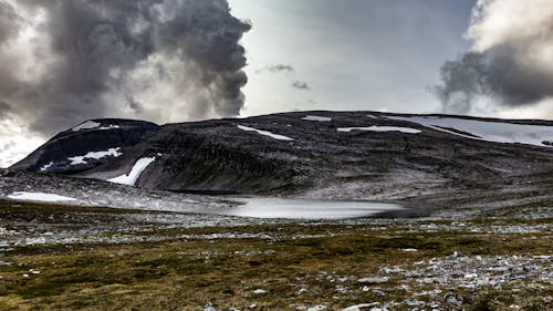 A dark black mountain in Norway in the Trollheimen group.