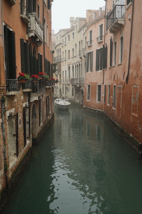 A narrow canal with buildings on both sides